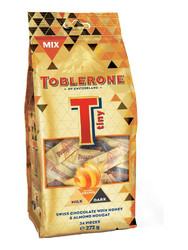 Продуктови Категории Шоколади Toblerone Tiny Gingery Orange 272g/ Тоблерон портокал,млечен и черен шоколад 272 гр. 34 бр.